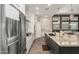 Modern kitchen with large island,granite countertops, and stainless steel appliances at 5273 N 207Th Dr, Buckeye, AZ 85396