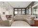 Open concept living and kitchen area with tile floors at 5273 N 207Th Dr, Buckeye, AZ 85396