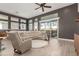 Open living area with sectional sofa and access to patio at 5273 N 207Th Dr, Buckeye, AZ 85396