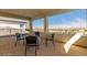 Covered patio with seating area and mountain views at 5273 N 207Th Dr, Buckeye, AZ 85396