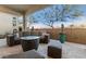 Outdoor patio furniture and firepit create a relaxing space at 5273 N 207Th Dr, Buckeye, AZ 85396