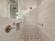 Spa-like shower with pebble floor and modern fixtures at 5273 N 207Th Dr, Buckeye, AZ 85396