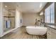 Modern bathroom with soaking tub, walk-in shower, and double vanity at 634 W Ranch Rd, Gilbert, AZ 85233