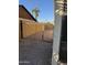 Gravel side yard with chain link fence and gate at 815 W Kiva Ave, Mesa, AZ 85210