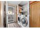 Laundry room with washer, dryer, and extra shelving at 9302 E Broadway Rd # 166, Mesa, AZ 85208