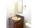 Clean bathroom with single sink vanity, mirror and shower/tub combo at 9431 E Coralbell Ave # 124, Mesa, AZ 85208