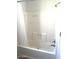 Clean bathroom with shower/tub, and white tile surround at 9431 E Coralbell Ave # 124, Mesa, AZ 85208