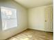 Bedroom with hardwood floors and window with blinds at 9431 E Coralbell Ave # 124, Mesa, AZ 85208