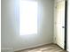 Spacious bedroom with a window and an adjacent door at 9431 E Coralbell Ave # 124, Mesa, AZ 85208
