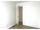 Bright bedroom with open door to closet and wood-look floors at 9431 E Coralbell Ave # 124, Mesa, AZ 85208