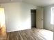 Spacious bedroom with hardwood floors and a large closet at 9431 E Coralbell Ave # 124, Mesa, AZ 85208