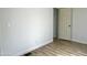Simple bedroom with hardwood floors and a closet at 9431 E Coralbell Ave # 124, Mesa, AZ 85208