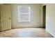 Well-lit bedroom with hardwood floors and ample space at 9431 E Coralbell Ave # 124, Mesa, AZ 85208