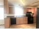 Galley kitchen with light wood cabinets and appliances at 9431 E Coralbell Ave # 124, Mesa, AZ 85208
