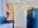 Galley kitchen with light wood cabinets and appliances at 9431 E Coralbell Ave # 124, Mesa, AZ 85208
