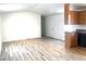 Bright living room with hardwood floors and access to kitchen at 9431 E Coralbell Ave # 124, Mesa, AZ 85208