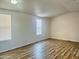 Light-filled living room featuring hardwood floors at 9431 E Coralbell Ave # 124, Mesa, AZ 85208
