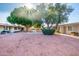 Complex exterior with courtyard, landscaping, and building at 10531 W Coggins Dr, Sun City, AZ 85351