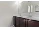 Double vanity bathroom with dark wood cabinets at 1241 E Paul Dr, Casa Grande, AZ 85122