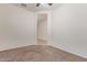 Spacious bedroom with ceiling fan and neutral carpeting at 1241 E Paul Dr, Casa Grande, AZ 85122