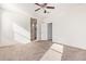 Primary bedroom with ceiling fan and access to bathroom at 1241 E Paul Dr, Casa Grande, AZ 85122