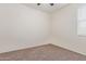 Well-lit bedroom featuring neutral wall paint and carpet at 1241 E Paul Dr, Casa Grande, AZ 85122