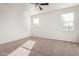 Large bedroom with two windows and neutral wall colors at 1241 E Paul Dr, Casa Grande, AZ 85122