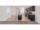 Open kitchen features granite countertops and dark wood cabinets at 1241 E Paul Dr, Casa Grande, AZ 85122