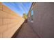 Side yard access with gravel pathway and gate at 1241 E Paul Dr, Casa Grande, AZ 85122