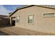 Tan two-story house with a two-car garage and desert landscaping at 12461 W Midway Ave, Glendale, AZ 85307