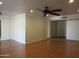 Open living area featuring hardwood floors and neutral walls at 3736 W Paradise Ln, Phoenix, AZ 85053