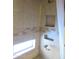 Shower stall with tiled walls and built-in shelves at 3736 W Paradise Ln, Phoenix, AZ 85053