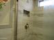 Clean shower with neutral tile and a modern shower head at 3736 W Paradise Ln, Phoenix, AZ 85053