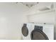 Laundry room with washer, dryer, and shelving at 3792 S Tower Ave, Chandler, AZ 85286