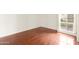 Bright bedroom with hardwood floors and window at 3828 N 32Nd St # 104, Phoenix, AZ 85018