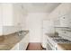 White kitchen with gas range, microwave and dishwasher at 3828 N 32Nd St # 104, Phoenix, AZ 85018