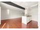 Open concept kitchen with white cabinets and hardwood floors at 3828 N 32Nd St # 104, Phoenix, AZ 85018