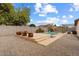 Inviting backyard oasis with a sparkling pool and patio area at 4494 E Brae Voe Way, San Tan Valley, AZ 85140