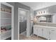 Clean bathroom with a white vanity, linen closet, and toilet at 4494 E Brae Voe Way, San Tan Valley, AZ 85140