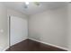 Bright bedroom with double door closet and dark wood flooring at 4494 E Brae Voe Way, San Tan Valley, AZ 85140