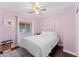 Light bedroom with double bed and colorful ceiling fan at 4494 E Brae Voe Way, San Tan Valley, AZ 85140