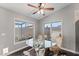 Cozy breakfast nook with glass-top table and two chairs at 4494 E Brae Voe Way, San Tan Valley, AZ 85140