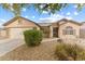 House exterior showcasing a two-car garage and well-maintained landscaping at 4494 E Brae Voe Way, San Tan Valley, AZ 85140