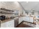White shaker cabinets, stainless steel appliances and wood-look flooring at 4494 E Brae Voe Way, San Tan Valley, AZ 85140