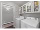 Laundry room with washer, dryer, and ample cabinet storage at 4494 E Brae Voe Way, San Tan Valley, AZ 85140