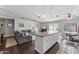 Open concept living area with kitchen island and grey sectional sofa at 4494 E Brae Voe Way, San Tan Valley, AZ 85140