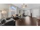 Living room featuring hardwood floors, gray furniture, and large windows at 4494 E Brae Voe Way, San Tan Valley, AZ 85140