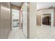 Well-lit hallway with laundry area and access to bedrooms at 4503 E Robin Ln, Phoenix, AZ 85050