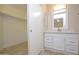 Bathroom features a vanity with mirror and a walk-in closet at 6709 W Luke Ave, Glendale, AZ 85303