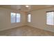 Bright bedroom with tile floors and neutral walls at 6709 W Luke Ave, Glendale, AZ 85303